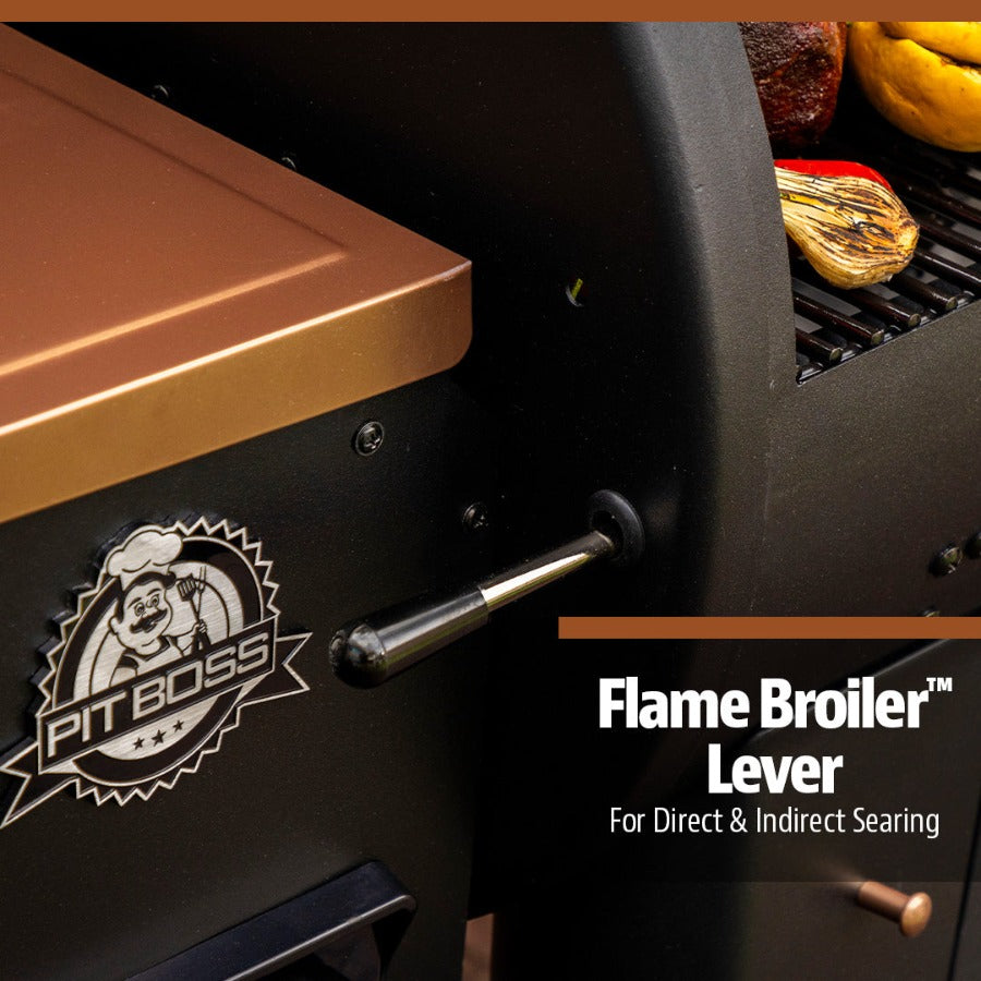 Close up of the flame broiler lever on the black grill with bronze accents.