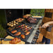 Meats and veggies cooking on both racks on the grills.