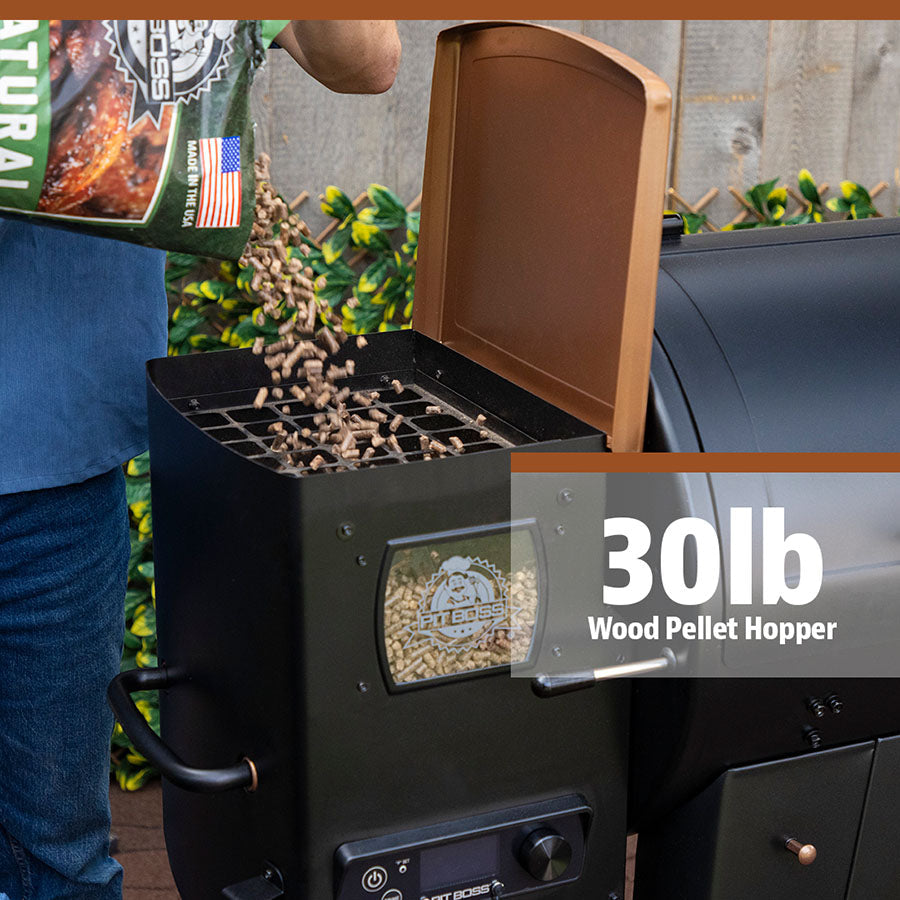 Pellets being poured into the 30 lb. wood pellet hopper