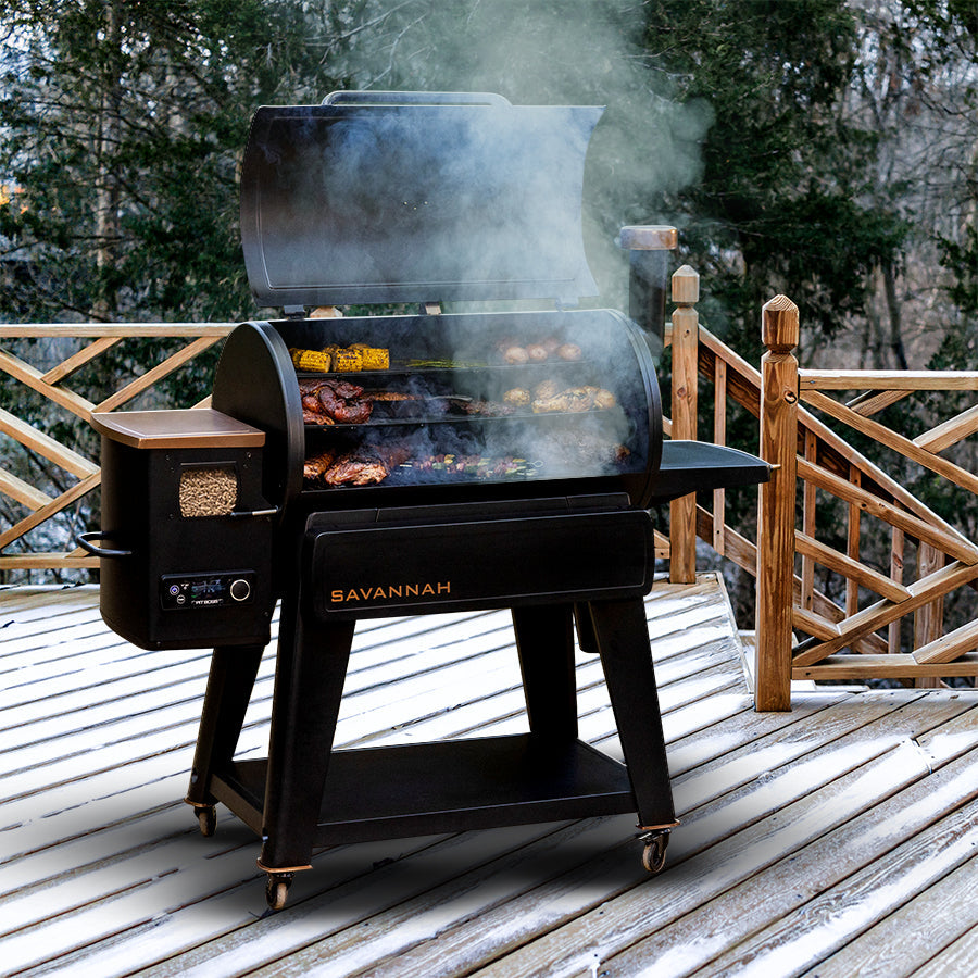 pit boss savannah wood pellet grill onyx edition grilling on snowy winter patio