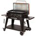 lifestyle_2, Black griddle with silver and orangeish-tan accents. Grill hood open. Side angle view