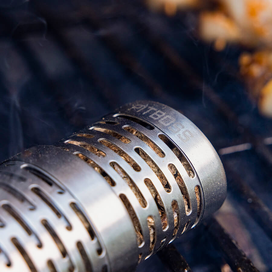 Close up of smoking tube in grill. Pit Boss name logo engraved at very top.