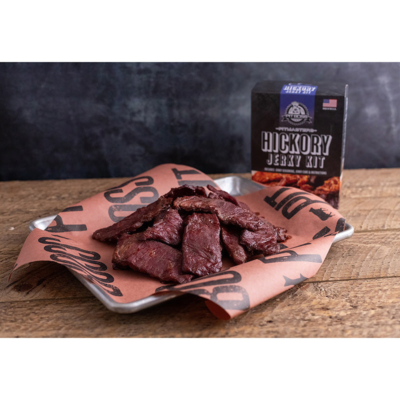 Pit Boss Original Hickory Jerky Kit with jerky in front of box.