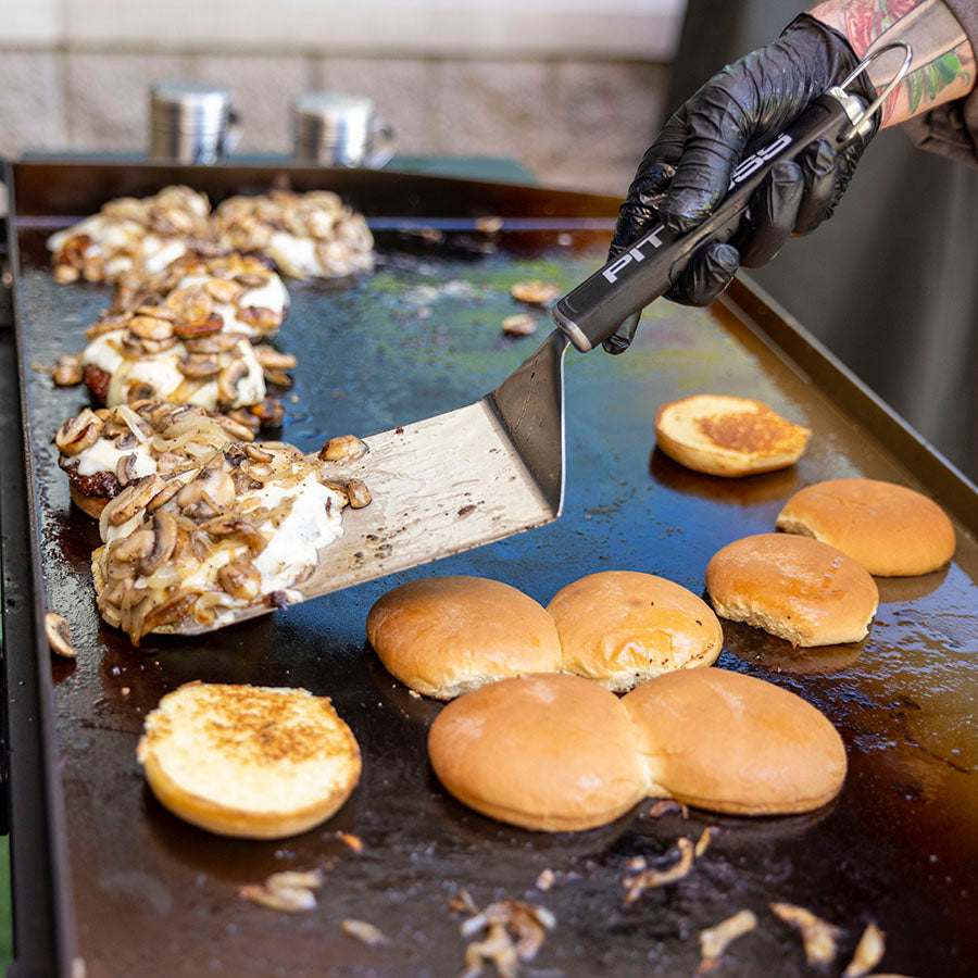 Close up of burger food flipped by Pit Boss big head spatula.