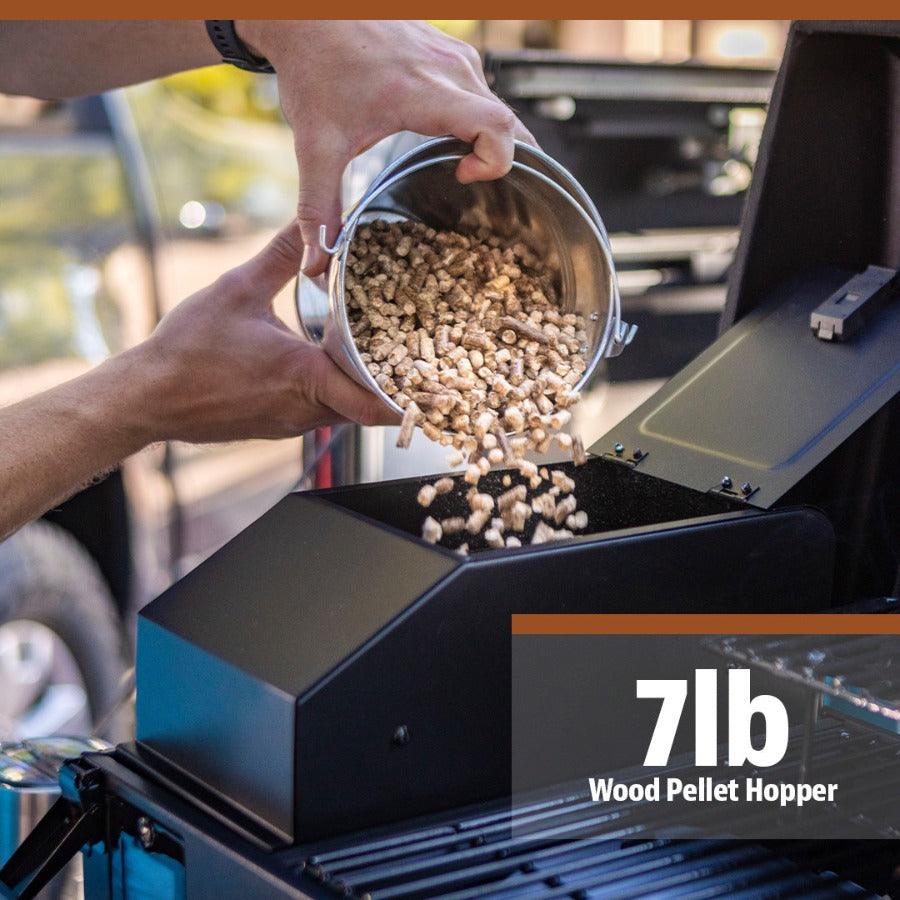 Close view of the portable grill being fueled by pit bosses wood pellets