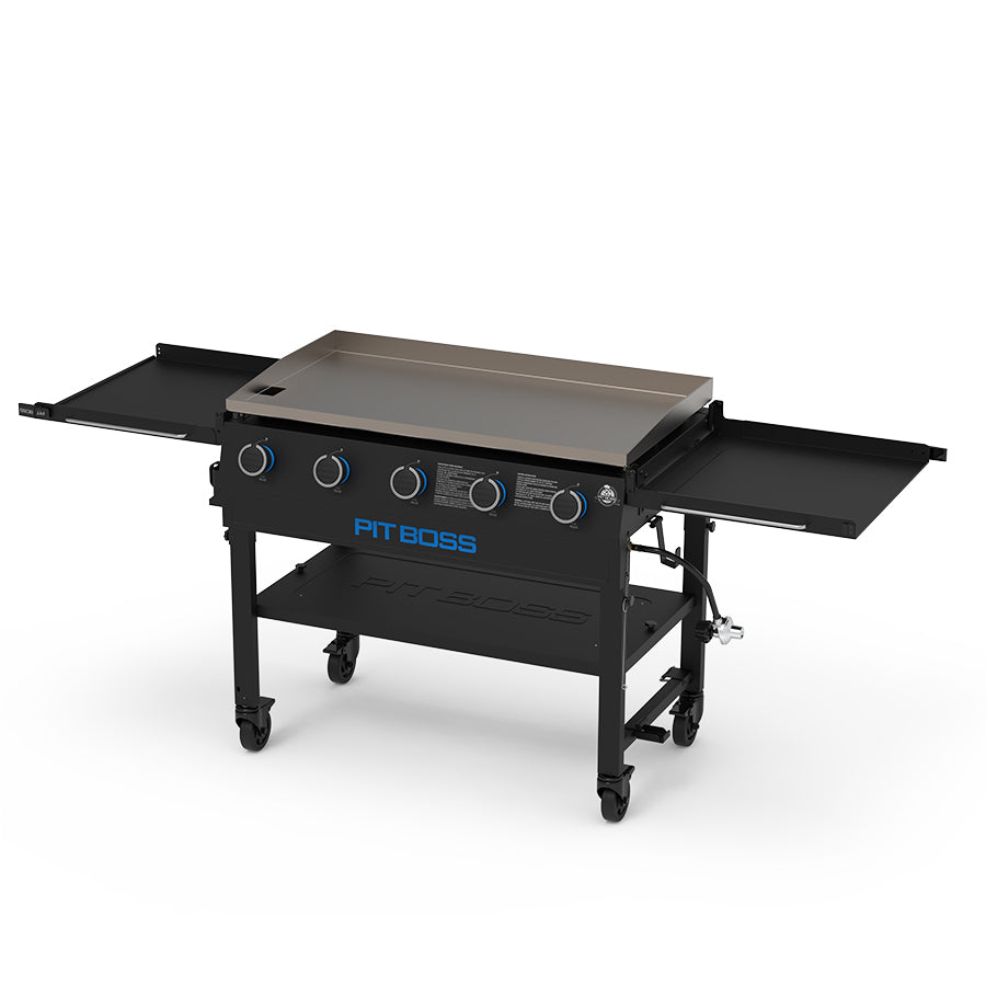 High viewpoint of the black and blue Pit Boss griddle. Both side tables open.