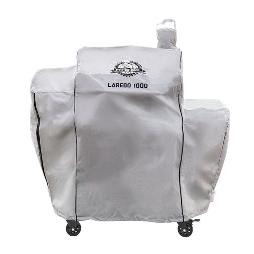 Silvery white cover with black accents, pit boss logo and 'laredo 1000' lettering on front