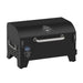 Pit Boss Portable Tabletop Pellet Grill, Black. Side angle view with digital control board and silver handle