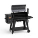 Pit Boss Pro Series 3 1150 Wood Pellet Grill. Now with Wi-Fi and bluetooth. Black grill with "pro Series" labeled in white on the front. Hood open. Side view.