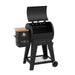 Pit Boss Lexington 500 Wood Pellet Grill. Black with orange accents. Hood open. Side viewpoint