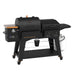 Charleston 1020 Combo Grill. Black with orange accents. Pit Boss logo on front of pellet hopper. Black grease bucket bellow grill.