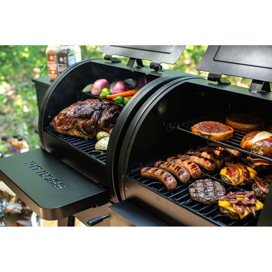 meats and veggies grilling on gas and pellet side of grill