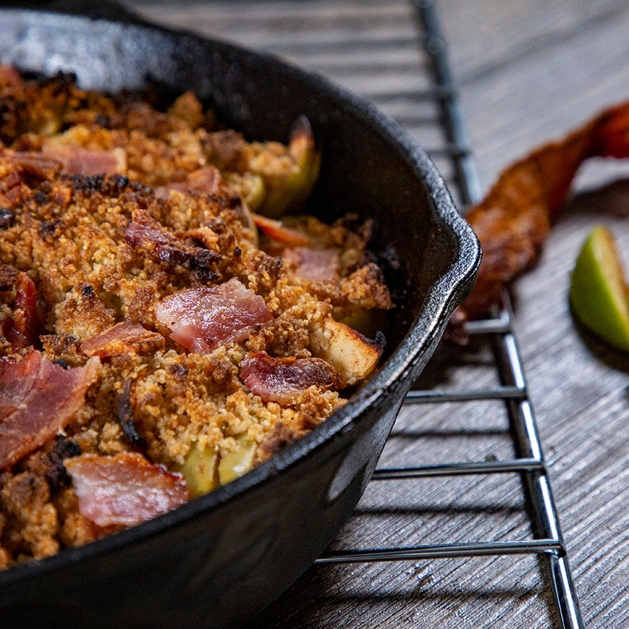 black 8 inch cast iron skillet with baked goods inside