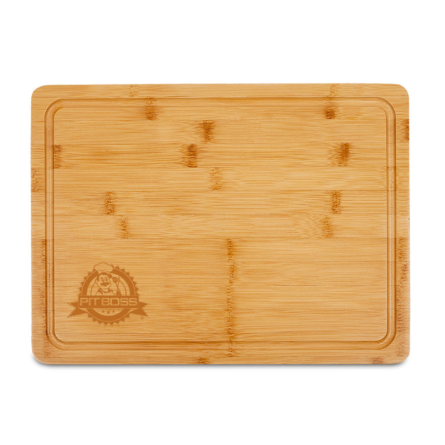 Light colored wood, rectangular shaped board with pit boss logo engraved in corner