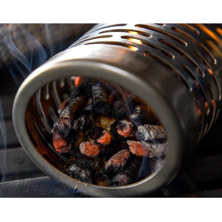 Close up of wood pellets in smoking tube in grill.